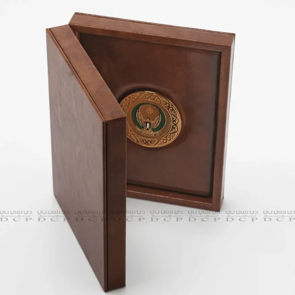 Full view of a luxury leather box with a gold-plated brass logo, designed for corporate gifting.