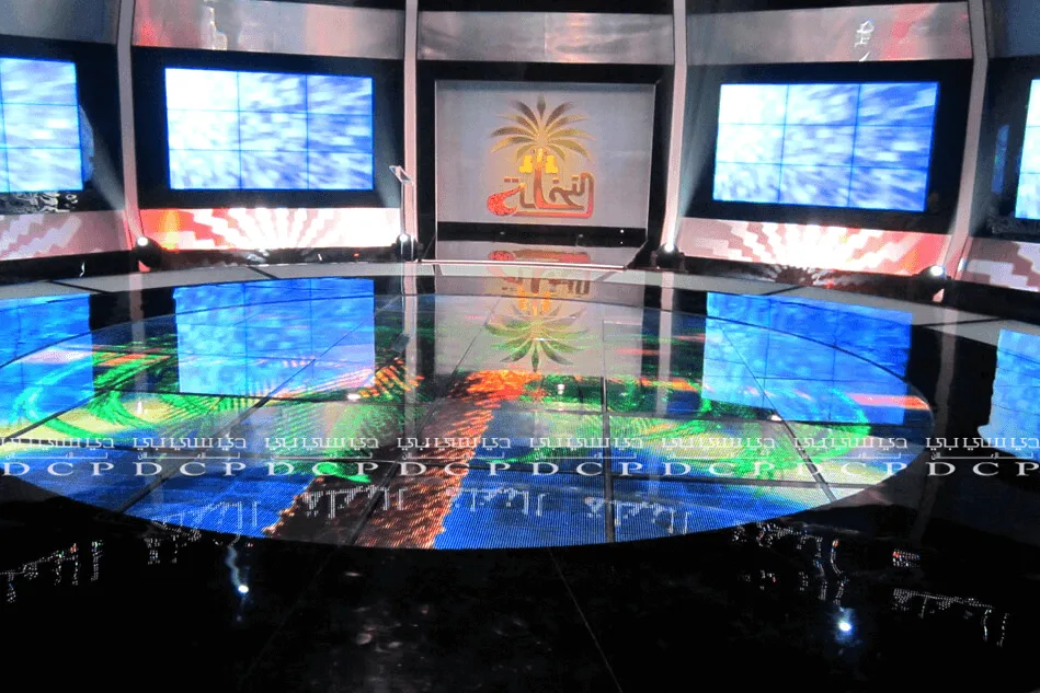 Complete stage Customization with branding, featuring a vibrant backdrop, branded podium, and decorative lighting for an event