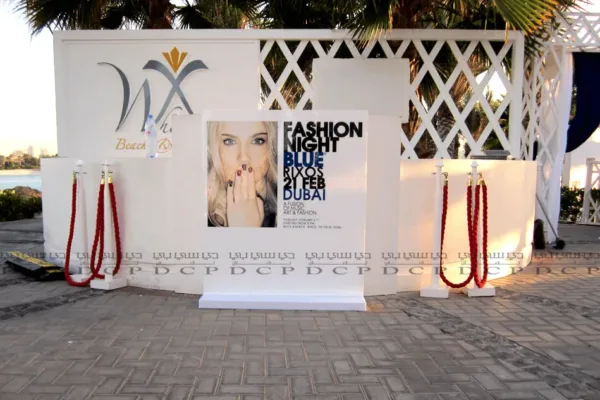 Branded Exhibition Stand Custom exhibition stand with vibrant graphics, integrated lighting, and modular shelving for a professional trade show display