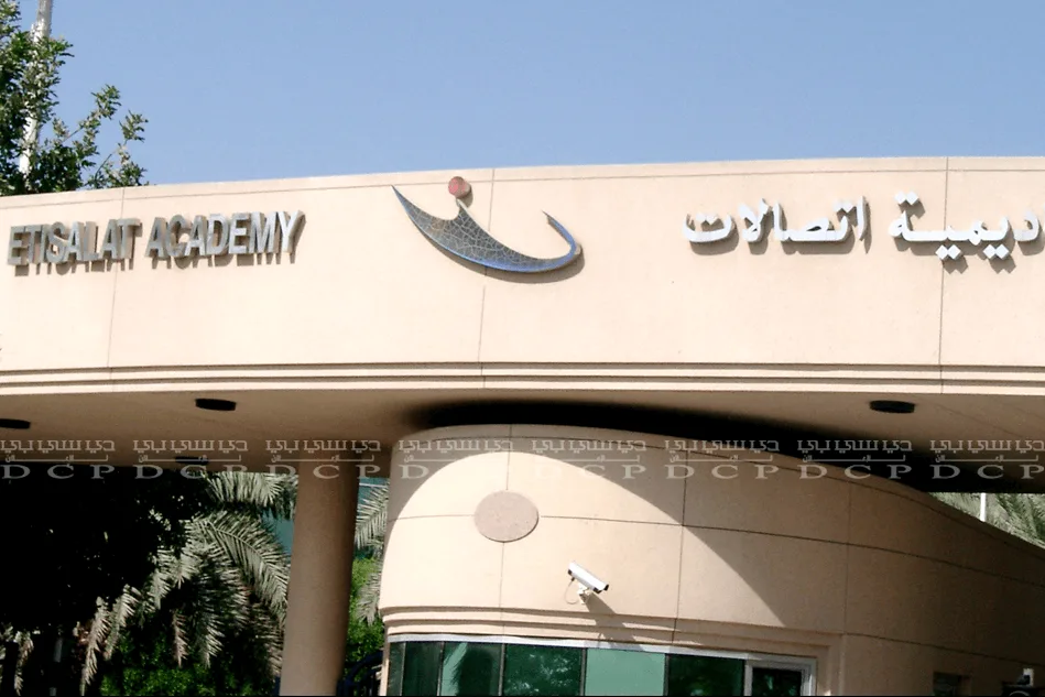 Full view of bespoke metal signage featuring an academy name with a sleek and polished finish, ideal for professional branding