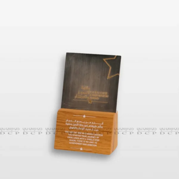 Custom Wood and Brass Sign with Personalized Text Full view of a Custom Wood and Brass Sign with Personalized Text, showcasing a polished brass panel mounted on a natural wood base